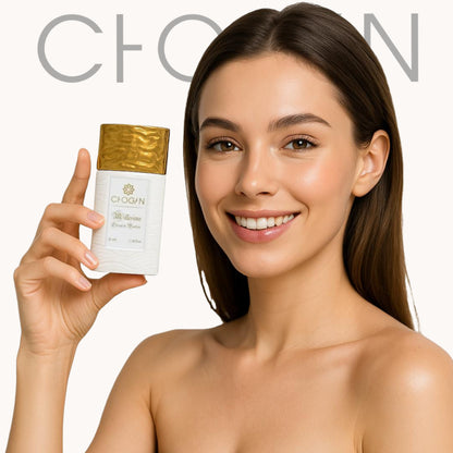 women holds chogan 35ml perfume in her hands, looks into the camera and smiles